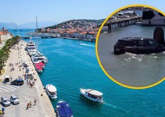 Drama v Trogirju: voznica z BMW-jem slovenskih registrskih oznak po trku pristala v morju (znane podrobnosti)